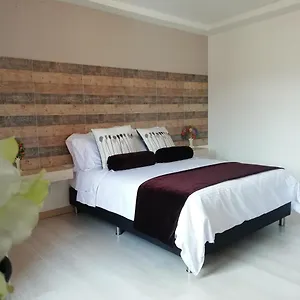 apartasuite-laureles-cmc.colombiamedellinhotels.com/